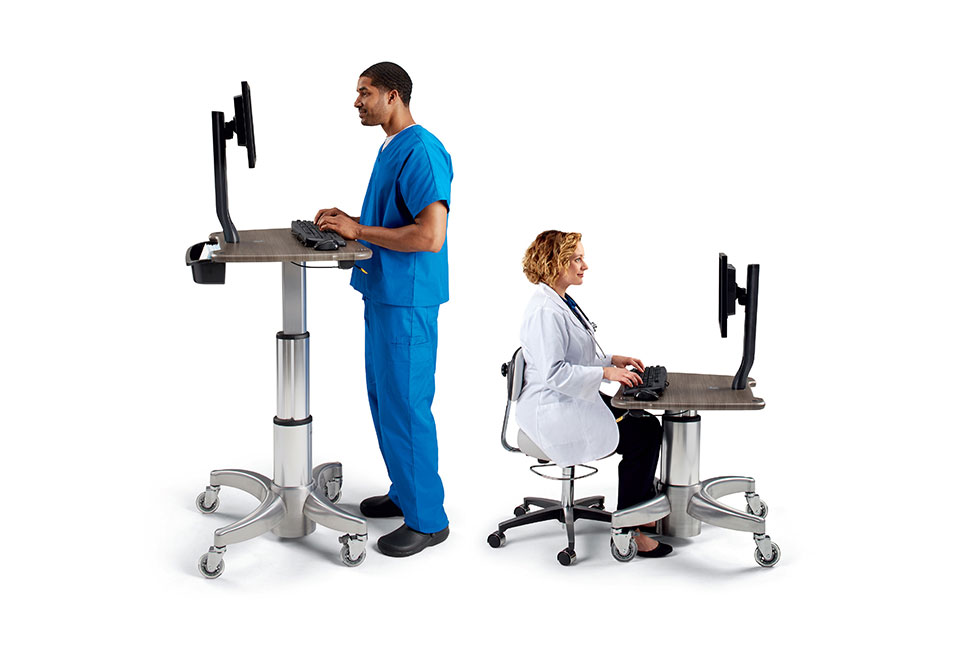 Nurse and doctor seen standing and seated at Midmark workstations