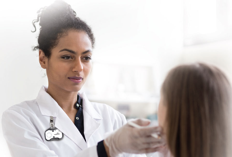 A dermatologist examining a patient