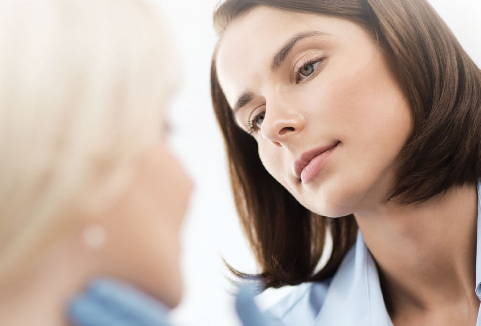 Doctor examining a patient's face