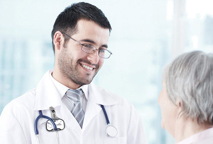 Smiling doctor looking at patient