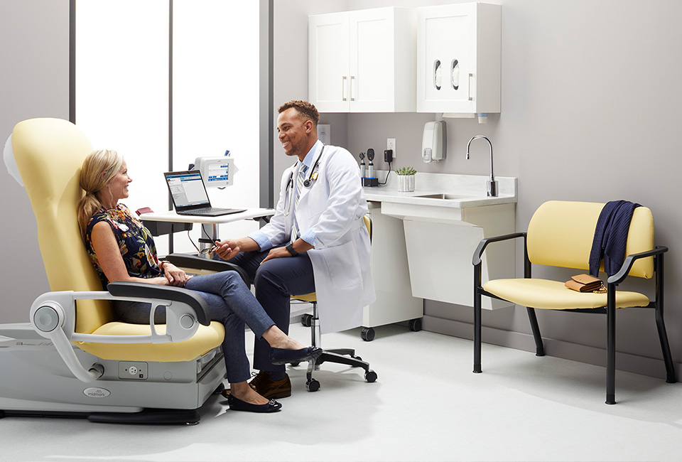 Doctor in conversation with patient in exam room