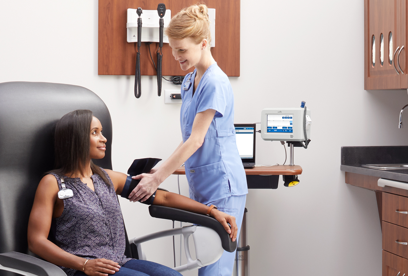 Nurse taking patient's blood pressure