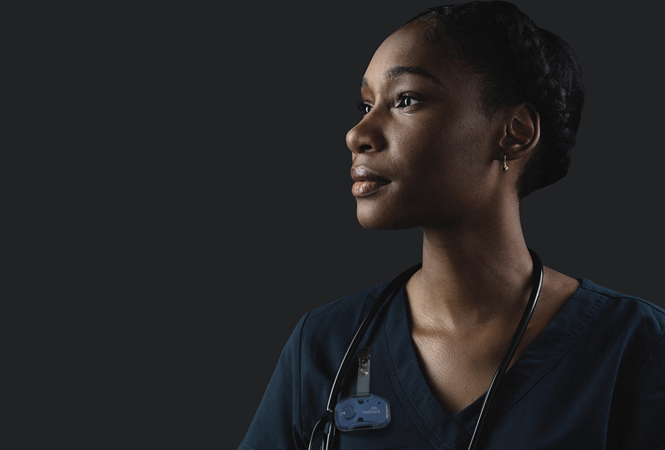 Profile of a nurse looking left on black background