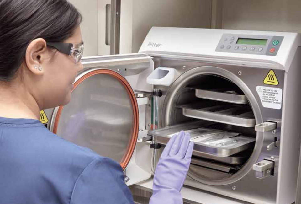 Medical staff operating Ritter sterilizer