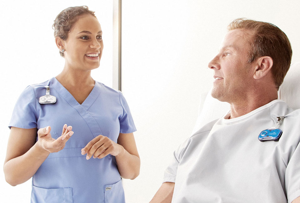 Nurse and patient wearing Midmark RTLS badges.