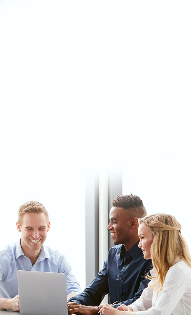 three midmark teammates sitting around laptop