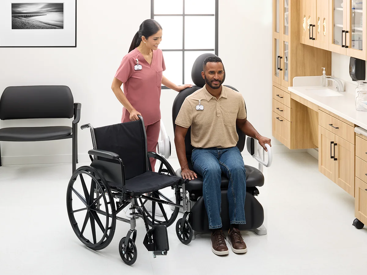 Patient sitting in accessible Midmark 631 procedure chair